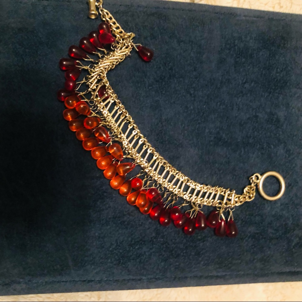 Gold bracelet with orange beads